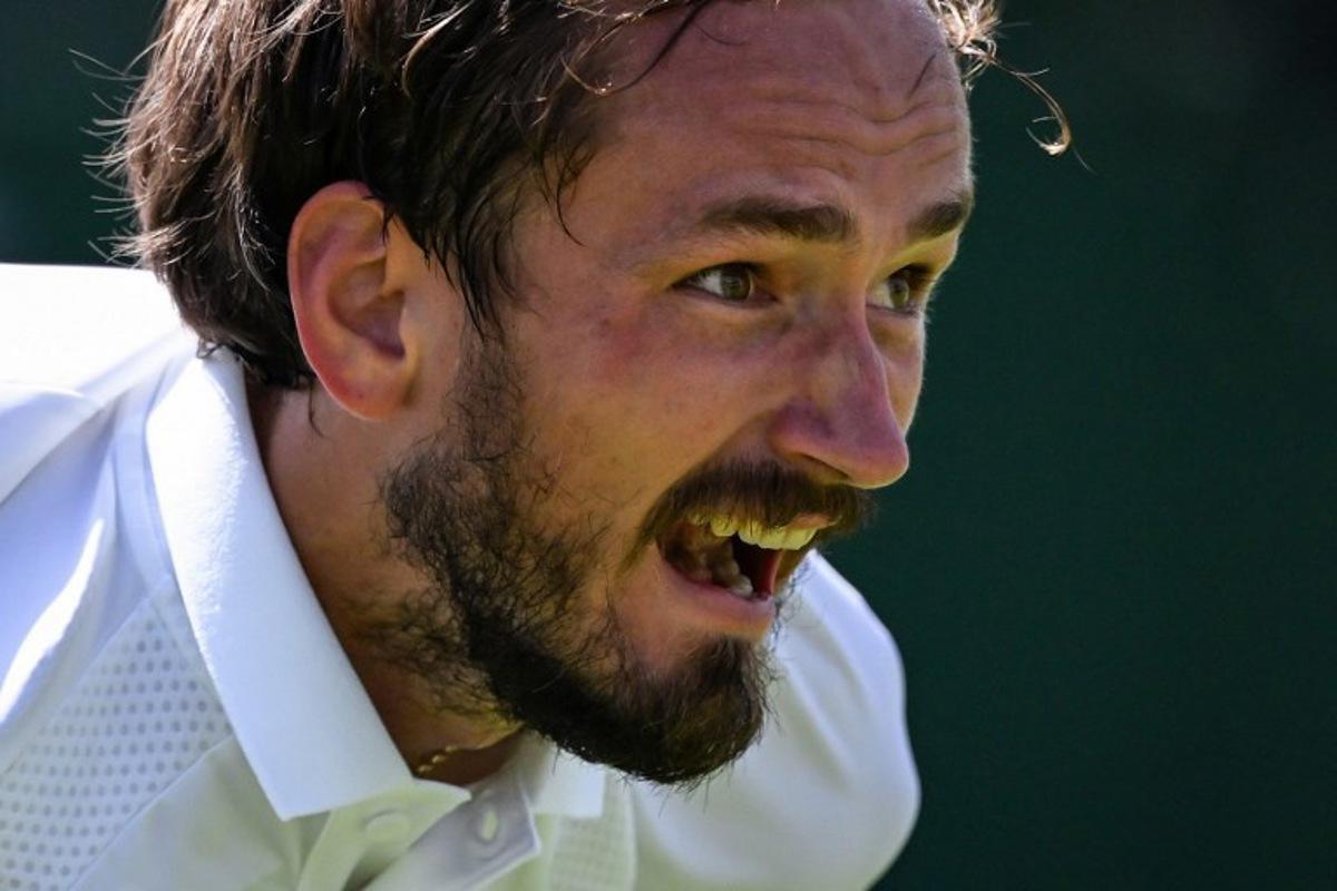 Russia's Daniil Medvedev reacts as he plays against France's Benjamin Bonzi during their men's singles first round tennis match on the first day of the 2025 Wimbledon Championships at The All England Lawn Tennis and Croquet Club in Wimbledon, southwest London, on June 30, 2025.  Kirill KUDRYAVTSEV / AFP