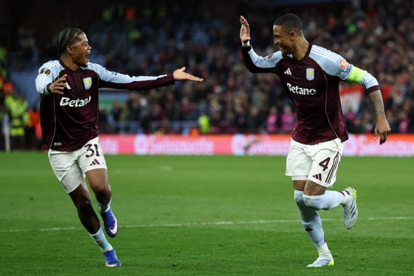 Aston Villa's English defender  #04 Ezri Konsa (R) celebrates scoring the team's fourth goal with Aston Villa's Jamaican midfielder #31 Leon Bailey during the UEFA Europa League, quarter final second-leg football match between Aston Villa and Bologna at Villa Park in Birmingham, central England on April 16, 2026.  Darren Staples / AFP