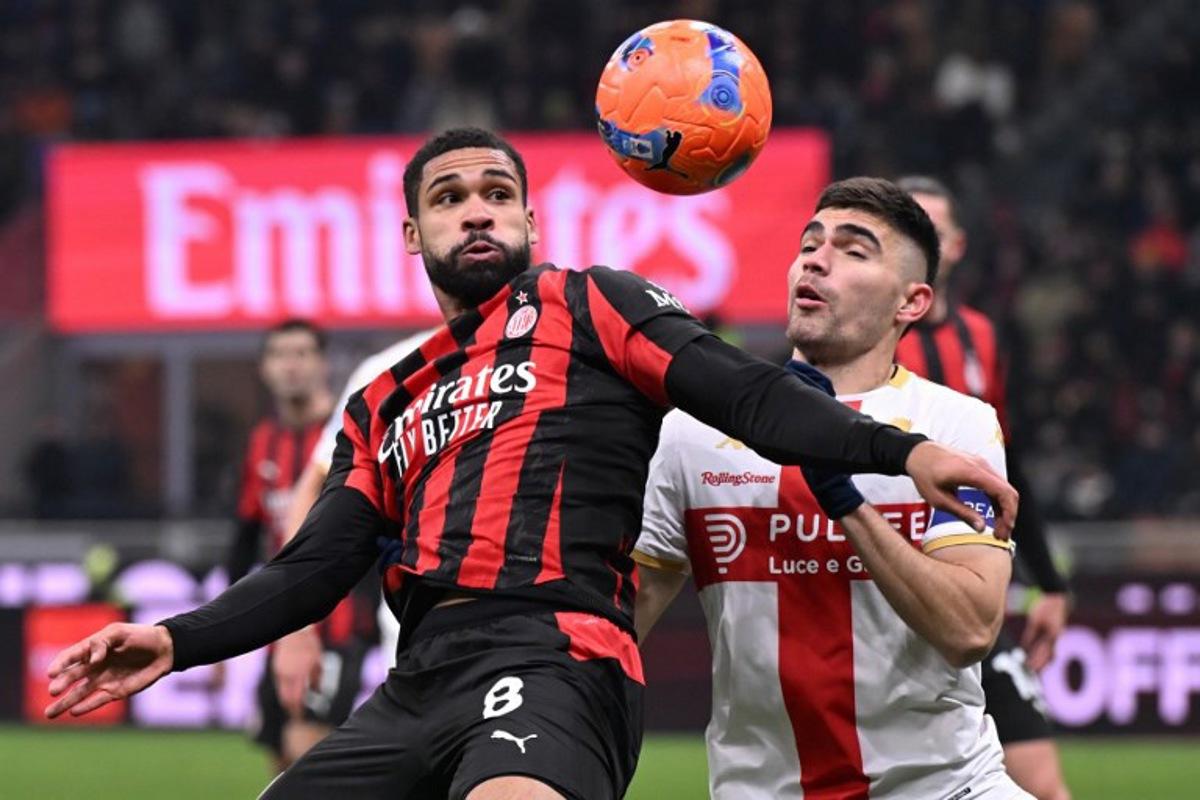 AC Milan's English midfielder #08 Ruben Loftus-Cheek (L) fights for the ball with Genoa's Mexican defender #22 Johan Vazquez during the Italian Serie A football match between AC Milan and Genoa at San Siro stadium in Milan, northern Italy, on January 8, 2025.  Stefano Rellandini / AFP
