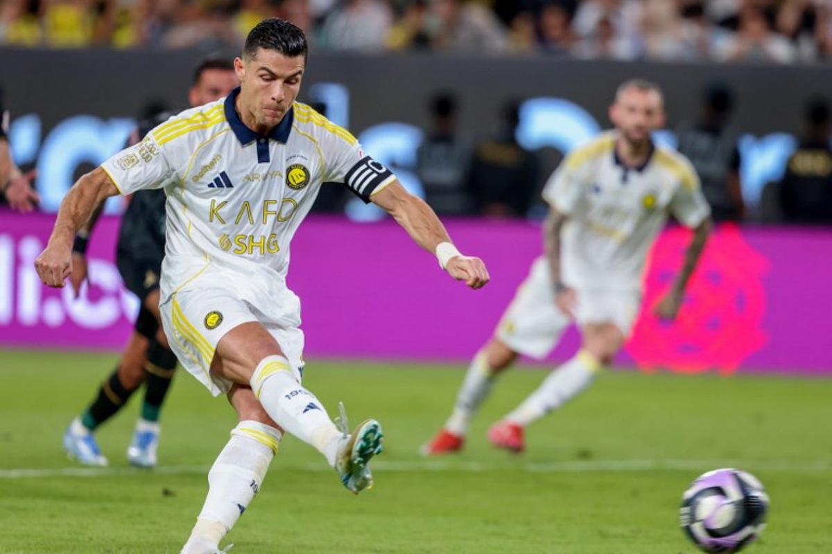Nassr's Portuguese forward #7 Cristiano Ronaldo shoots from the penalty spot to miss during the Saudi Pro League football match between Al-Nassr and Al-Khaleej at Al-Awwal Park in Riyadh on May 21, 2025.  Fayez NURELDINE / AFP