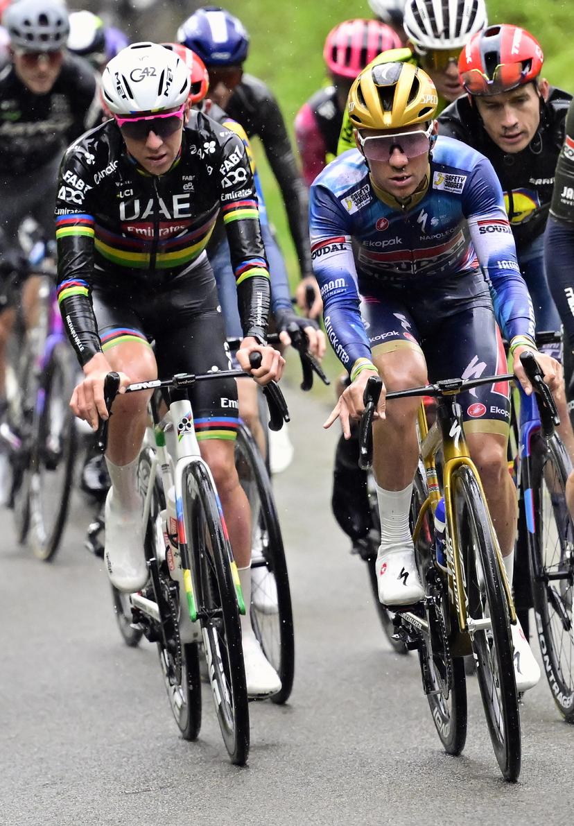 Slovenian Tadej Pogacar of UAE Team Emirates and Belgian Remco Evenepoel of Soudal Quick-Step pictured in action during the men's race of the 'La Fleche Wallonne', one day cycling race (Waalse Pijl - Walloon Arrow), 205,2 km from Ciney to Huy, Wednesday 23 April 2025. BELGA PHOTO DIRK WAEM