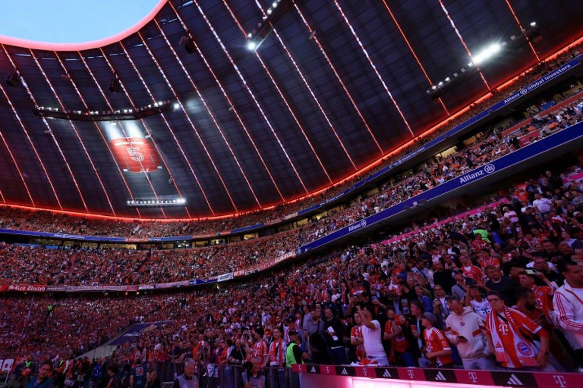 Fans gather at the Allianz Arena stadium prior to the German first division Bundesliga football match between FC Bayern Munich and RB Leipzig in Munich, southern Germany, on August 22, 2025.  Karl-Josef Hildenbrand / AFP