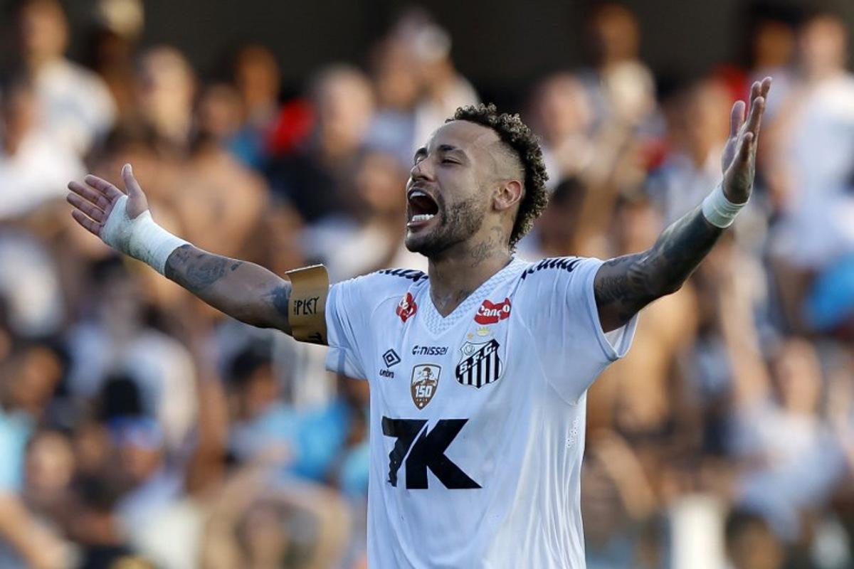 (FILES) Santos' forward #10 Neymar celebrates at the end of the Brasileirao Serie A football match between Santos and Cruzeiro at the Urbano Caldeira Stadium in Santos, Sao Paulo state, Brazil on December 7, 2025. Crucial goals in the final stretch to save Santos from relegation in Brazilian football, injuries, harsh criticism and a future full of doubts: Neymar had a crazy 2025. Miguel Schincariol / AFP