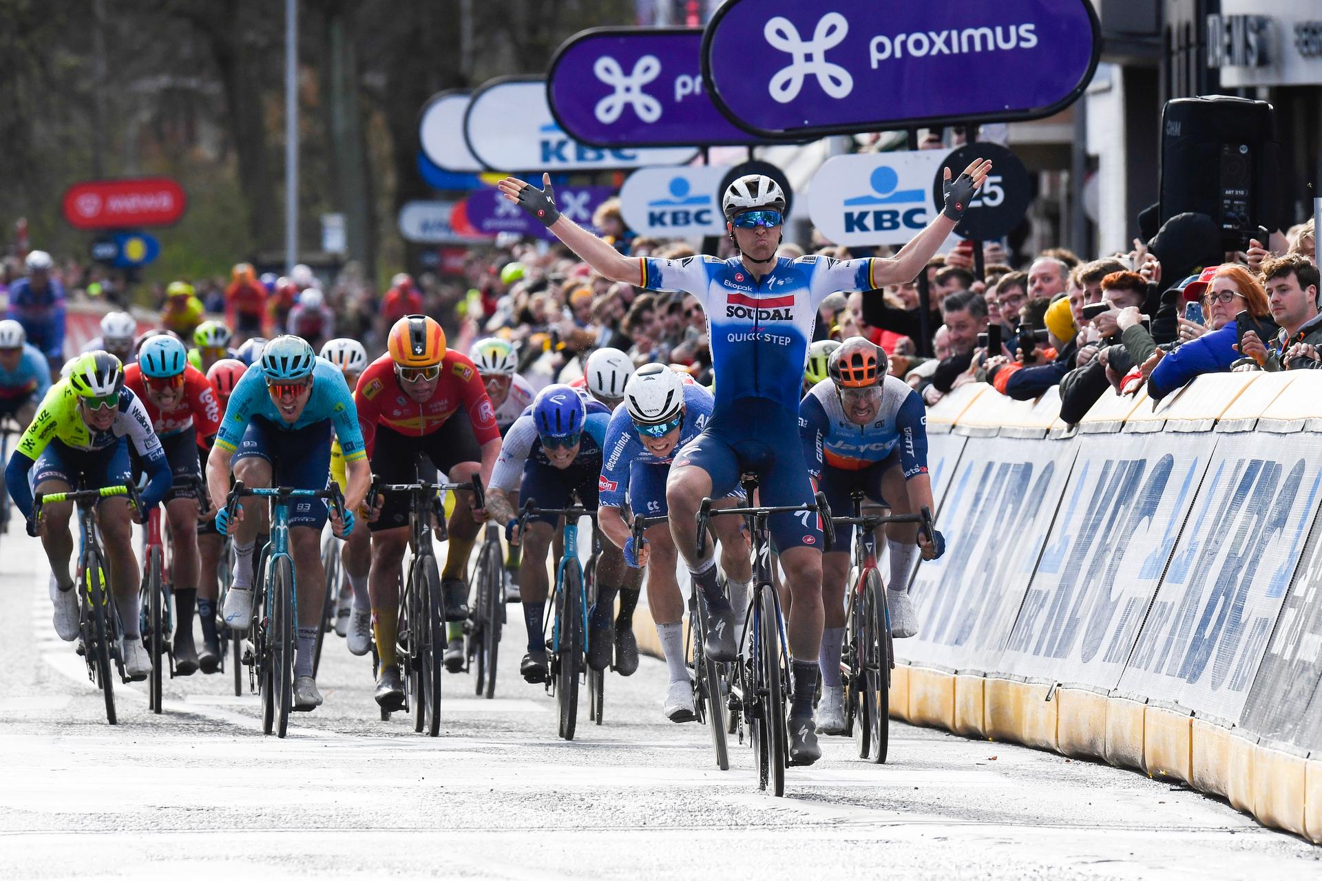 Belgian Tim Merlier of Soudal Quick-Step celebrates as he crosses the finish line to win the start of the men's race of the 112th edition of the 'Scheldeprijs' one day cycling event, 205,3 km from Terneuzen, the Netherlands to Schoten, Belgium on Wednesday 03 April 2024. BELGA PHOTO MARC GOYVAERTS