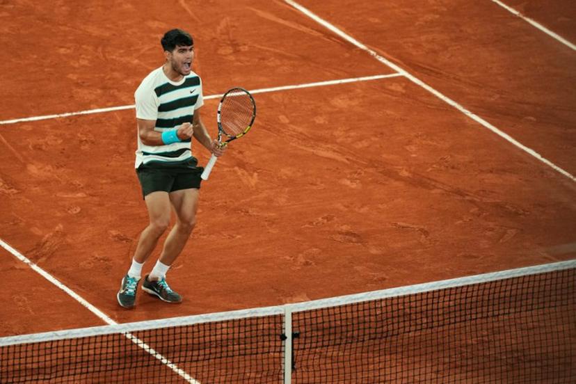 Spain's Carlos Alcaraz reacts to a point against as he plays against Italy's Lorenzo Musetti during their men's singles semi-final match on day 13 of the French Open tennis tournament on Court Philippe-Chatrier at the Roland-Garros Complex in Paris on June 6, 2025.  Dimitar DILKOFF / AFP