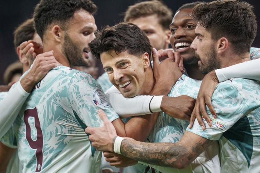 Portugal's defender #20 Joao Cancelo (C) celebrates scoring the opening goal with his teammates during the UEFA Nations League Group A4 match between Denmark and Portugal at Parken stadium in Copenhagen on October 1, 2026.   Liselotte Sabroe / Ritzau Scanpix / AFP