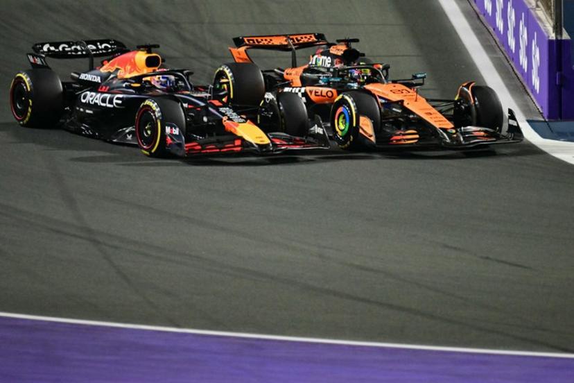 Red Bull Racing's Dutch driver Max Verstappen and McLaren's Australian driver Oscar Piastri race during the 2025 Saudi Arabia Formula One Grand Prix at the Jeddah Corniche Circuit on April 20, 2025.  Giuseppe CACACE / AFP