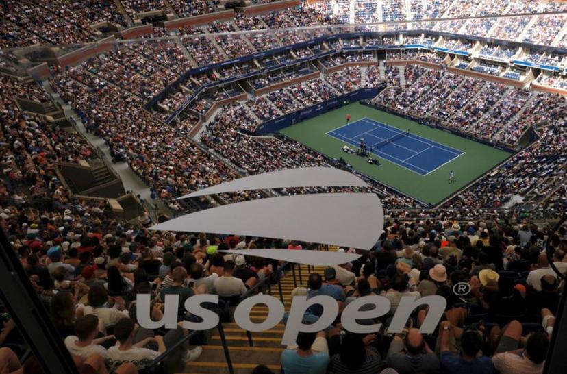 Attendees watch as USA's Taylor Fritz faces Serbia's Novak Djokovic during the US Open tennis tournament men's singles quarter-finals match at the USTA Billie Jean King National Tennis Center in New York City, on September 5, 2023.  Kena BETANCUR / AFP