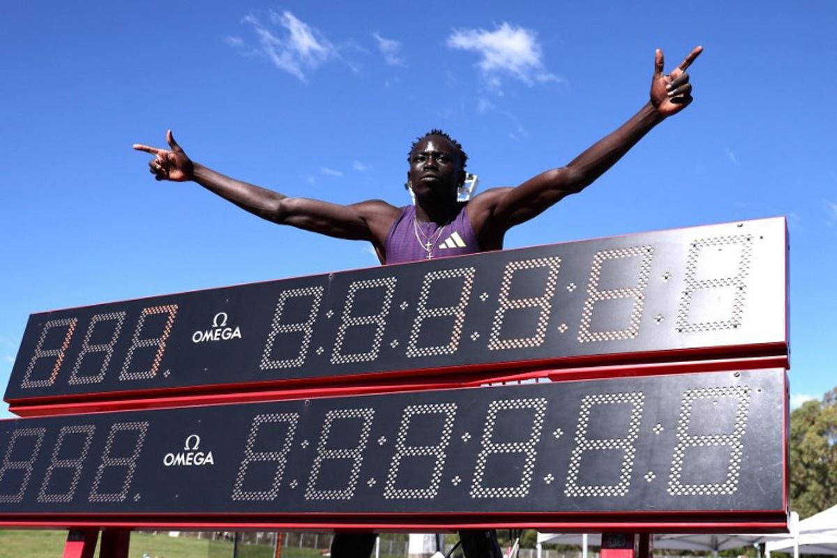 Australia's Gout Gout celebrates after winning the men's 200M final at the Australian Athletics Championships in Sydney on April 12, 2026.  DAVID GRAY / AFP