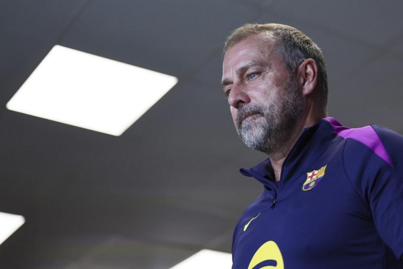 Barcelona's coach Hansi Flick leaves after giving a press conference on the eve of the UEFA Champions League league phase day 3 football match between FC Barcelona and Olympiakos at the Joan Gamper training ground in Sant Joan Despi, near Barcelona, on October 20, 2025.   Josep LAGO / AFP