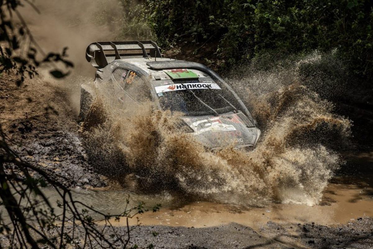 Toyota Gazoo Racing WRT's British driver Elfyn Evans steers his Toyota GR Yaris Rally1 with British co-driver Scott Martin during the World Rally Championship (WRC) Safari Rally Kenya Special Stage 13 (SS13) in Gilgil on March 22, 2025.  Luis TATO / AFP