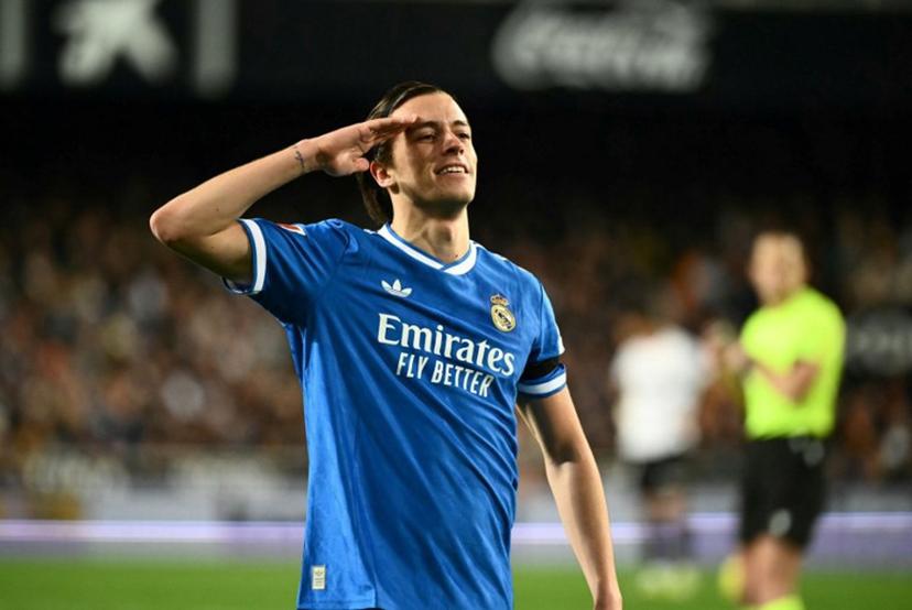 Real Madrid's Spanish defender #18 Alvaro Carreras celebrates scoring his team's first goal during the Spanish league football match between Valencia CF and Real Madrid CF at Mestalla Stadium in Valencia on February 8, 2026.  JOSE JORDAN / AFP