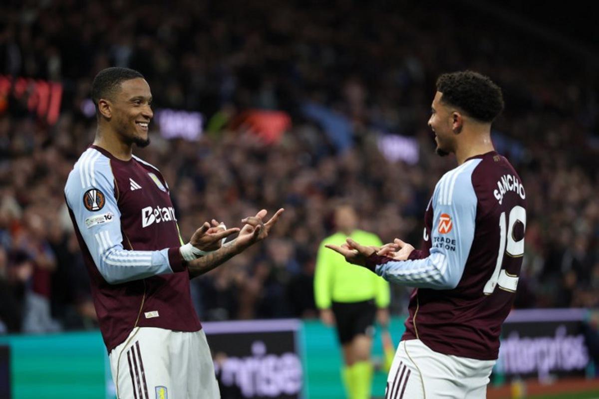 Aston Villa's English defender  #04 Ezri Konsa (L) celebrates scoring the team's fourth goal with Aston Villa's English defender  #19 Jadon Sancho during the UEFA Europa League, quarter final second-leg football match between Aston Villa and Bologna at Villa Park in Birmingham, central England on April 16, 2026.  Darren Staples / AFP