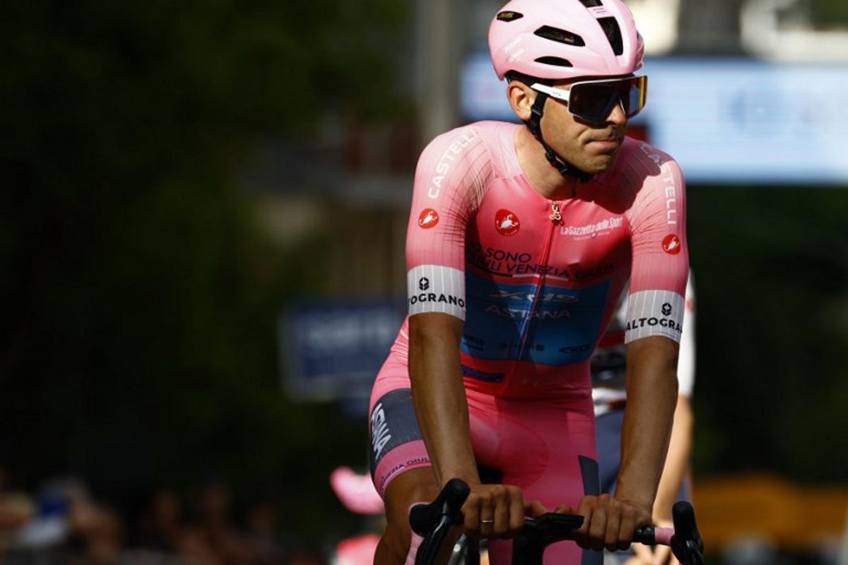 XDS Astana Team Uruguayan rider Guillermo Silva wearing the overall leader's pink jersey (Maglia Rosa) crosses the finish line during the 4th stage of the Giro d'Italia 2026 - Tour of Italy cycling race between Catanzaro and Cosenza, Italy, on May 12, 2026.  Luca Bettini / AFP