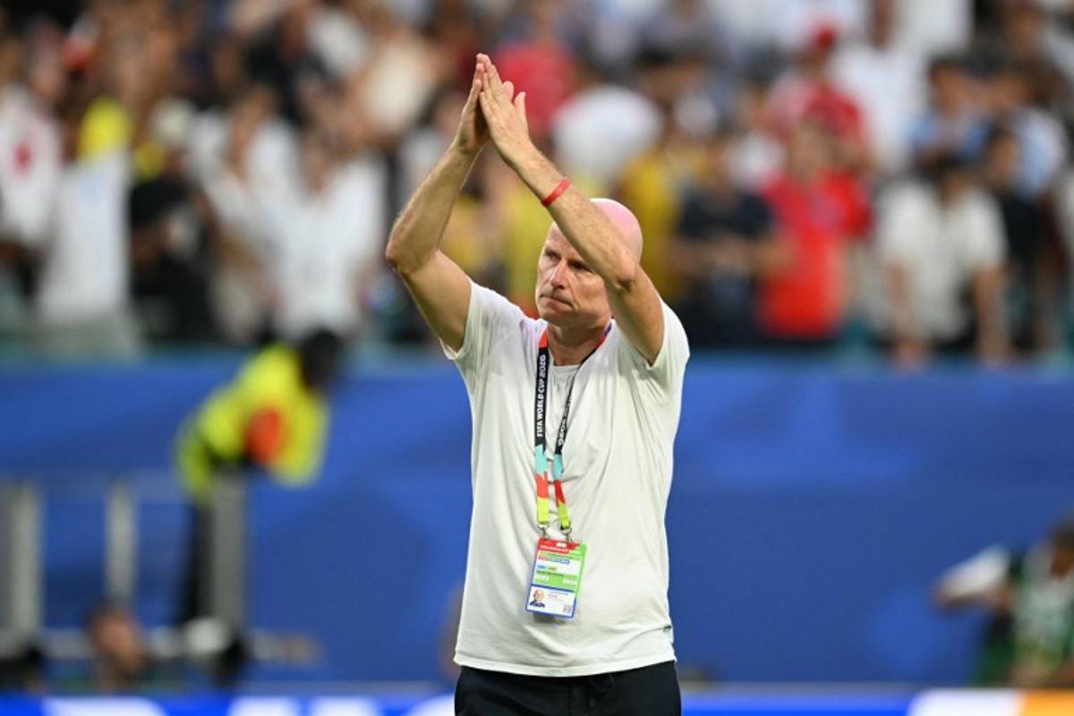 Norway's head coach Staale Solbakken greets fans after losing the 2026 World Cup football tournament quarter-final match between Norway and England at Miami Stadium in Miami Gardens on July 11, 2026.   CHANDAN KHANNA / AFP