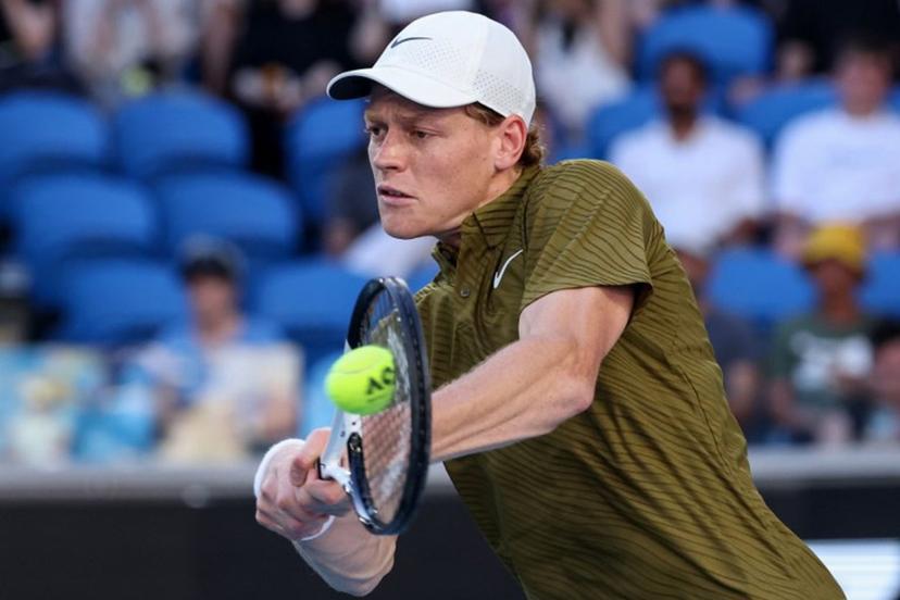 Italy's Jannik Sinner hits a shot against Italy's Luciano Darderi during their men's singles match on day nine of the Australian Open tennis tournament in Melbourne on January 26, 2026.  DAVID GRAY / AFP