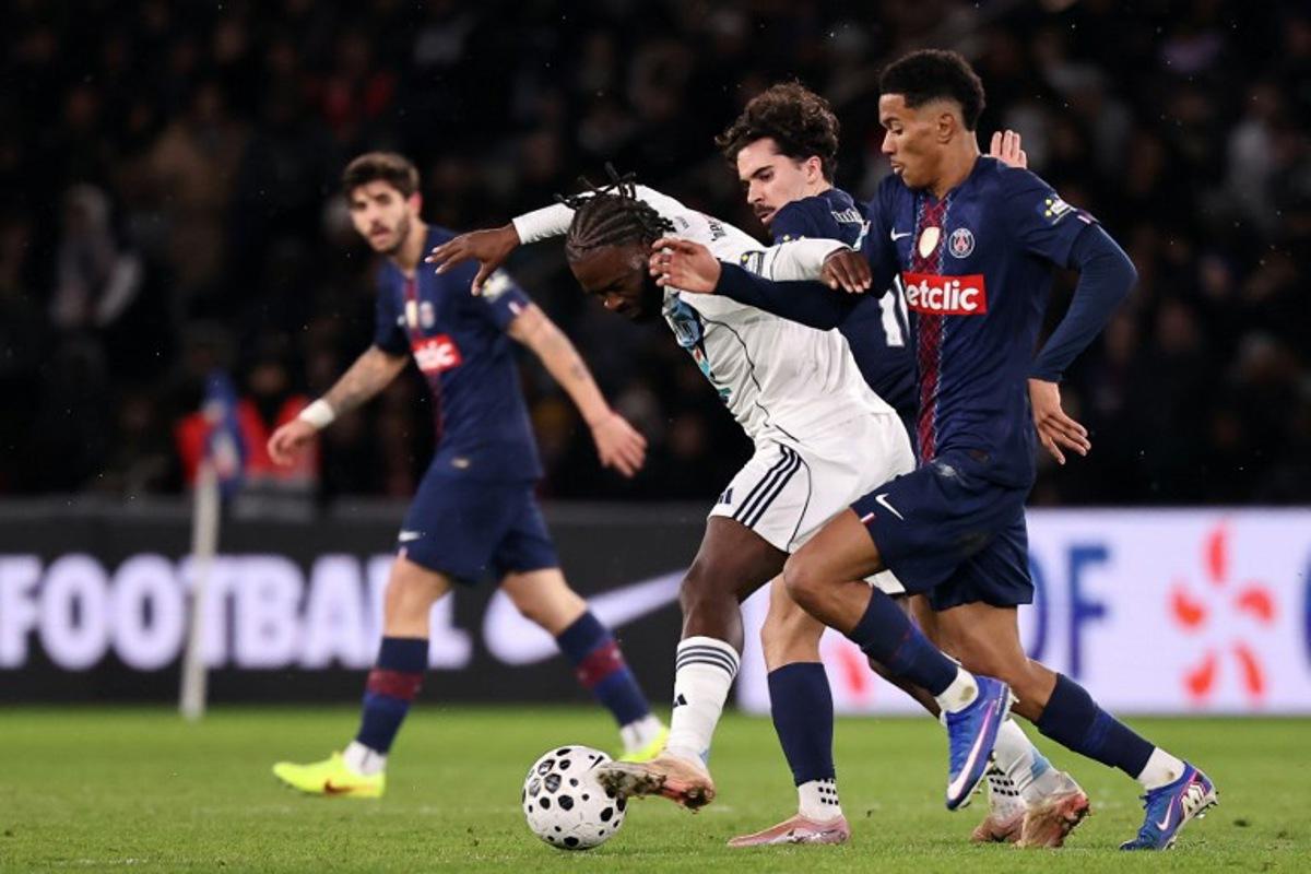 Paris FC's French midfielder #14 Jonathan Ikone (C) fights for the ball with Paris Saint-Germain's Portuguese midfielder #10 Vitinha (2R) and Paris Saint-Germain's French midfielder #03 Senny Mayulu (R) during the French Cup round of 32 football match between between Paris Saint-Germain (PSG) and Paris FC at the Parc des Princes stadium in Paris on January 12, 2026.  Anne-Christine POUJOULAT / AFP