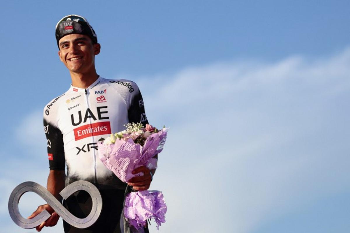 Second placed UAE Team Emirates XRG's Mexican rider Isaac Del Toro celebrates on the podium at the end of the 21st and last stage of the 108th Giro d'Italia cycling race of 143kms from Rome to Rome on June 1, 2025.  Luca Bettini / AFP