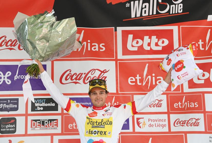 Belgian Lennert Teugels of Tarteletto - Isorex wearing the white jersey for leader in the climbers ranking celebrates on the podium of the first stage of the Tour De Wallonie cycling race, from Temploux to Huy (173,85 km), on Saturday 23 July 2022. BELGA PHOTO JOHN THYS