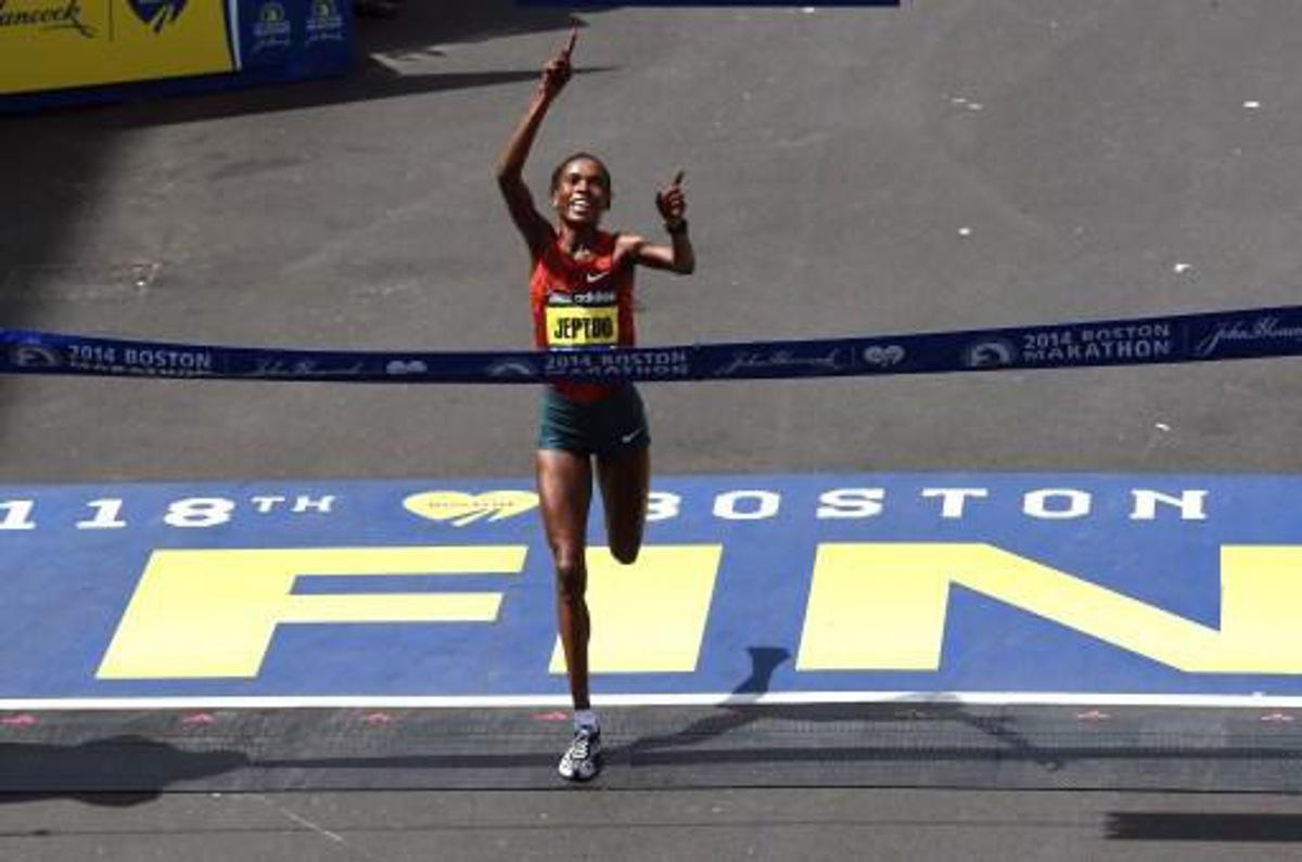 Rita Jeptoo of Kenya crosses the finish line to win the Women's Elite division of the 118th Boston Marathon in Boston, Massachusetts April 21, 2014.  AFP PHOTO / Timothy A. CLARY