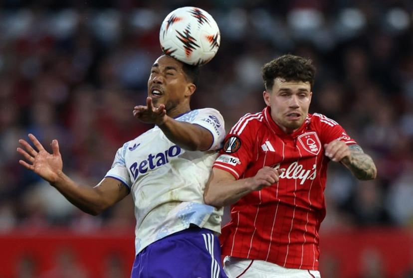 Aston Villa's Belgian midfielder  #08 Youri Tielemans jumps above Nottingham Forest's Welsh defender #03 Neco Williams to header the ball during the UEFA Europa League semi-final first-leg football match between Nottingham Forest and Aston Villa at The City Ground in Nottingham, central England, on April 30, 2026.  Darren Staples / AFP