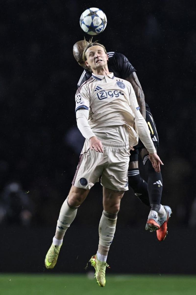 Ajax's Danish forward #09 Kasper Dolberg and Qarabag's Colombian defender #81 Kevin Medina vie for the ball during the UEFA Champions League league phase football match between Qarabag and Ajax at the Tofiq Bahramov Republican Stadium in Baku on December 10, 2025.  Giorgi ARJEVANIDZE / AFP