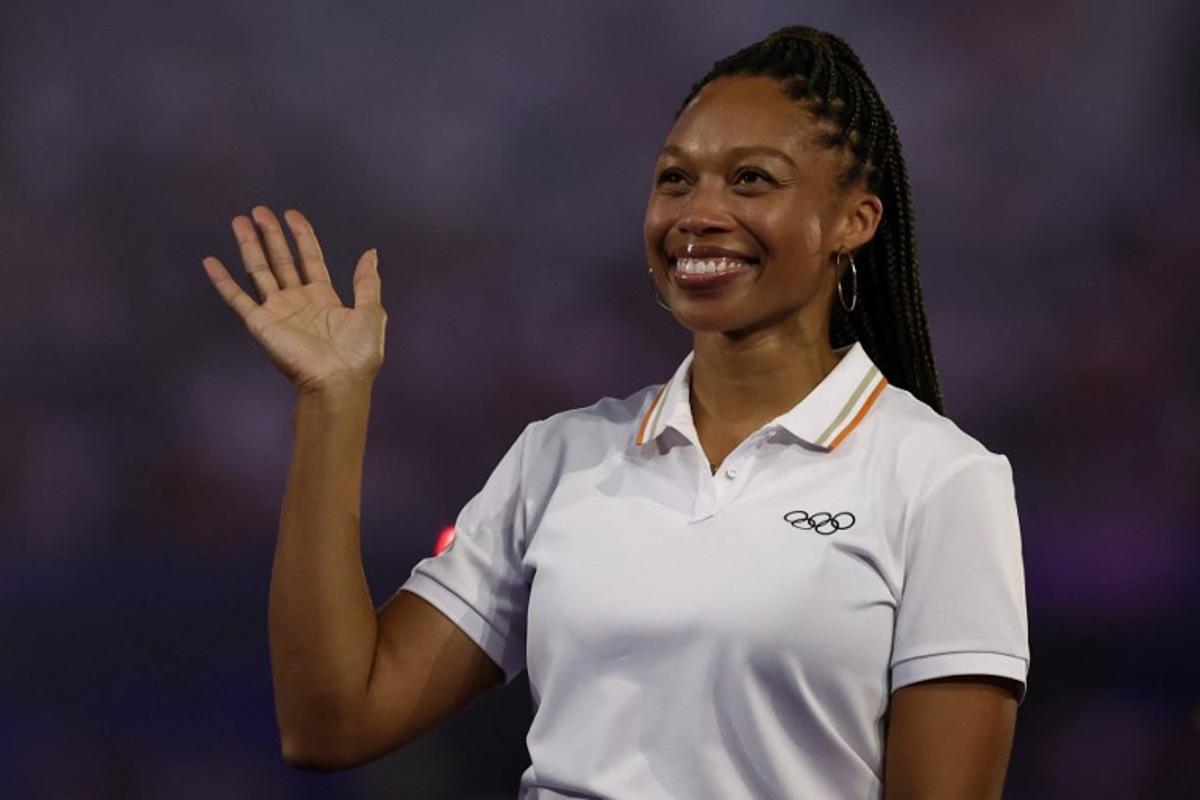US' athlete Allyson Felix waves as she is presented by Paris 2024 Olympians as a new member of the IOC Athletes' Commission during the closing ceremony of the Paris 2024 Olympic Games at the Stade de France, in Saint-Denis, in the outskirts of Paris, on August 11, 2024.  Franck FIFE / AFP