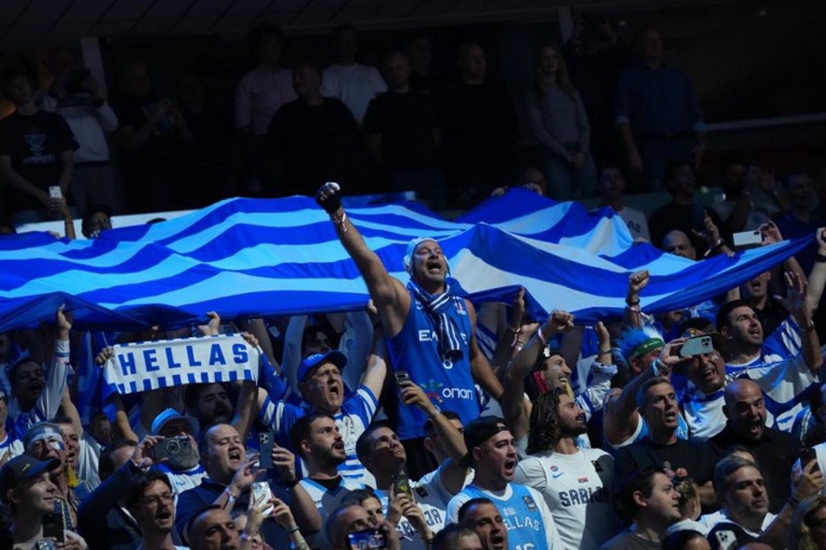 Greece's fans cheer for their team prior to the start of the FIBA EuroBasket 2025 semi-final basketball match between Greece and Turkey in Riga, Latvia, on September 12, 2025.  Gints Ivuskans / AFP