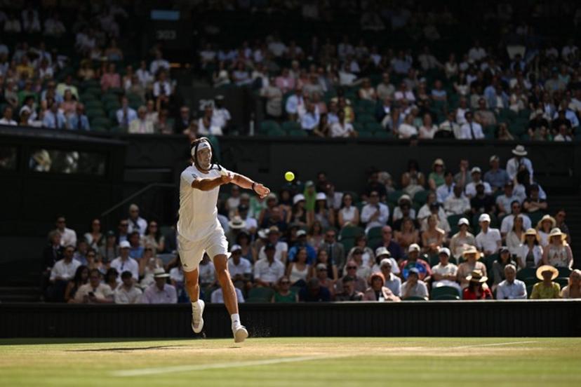 Germany's Alexander Zverev returns to Czech Republic's Jiri Lehecka during their men's singles round of 16 tennis match on the ninth day of the 2026 Wimbledon Championships at The All England Lawn Tennis and Croquet Club in Wimbledon, southwest London, on July 7, 2026.  Glyn KIRK / AFP
