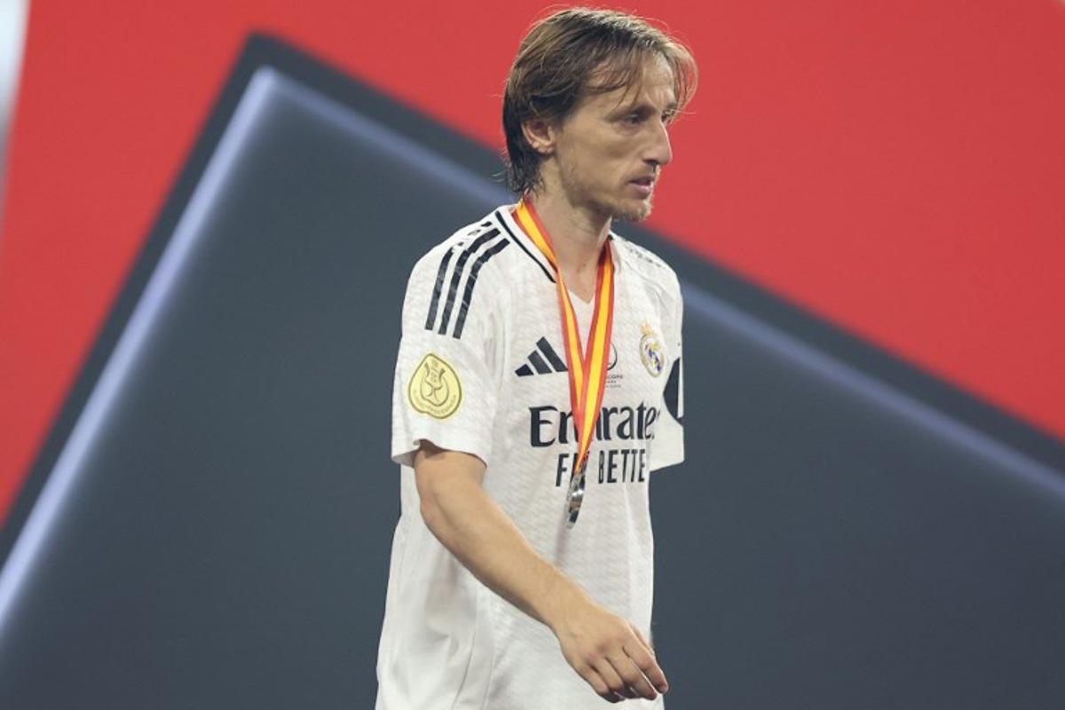 Real Madrid's Croatian midfielder #10 Luka Modric walks after receiving his medal at the end of the Spanish Super Cup final football match between Real Madrid and Barcelona at the King Abdullah Sport City in Jeddah on January 12, 2025.  Haitham AL-SHUKAIRI / AFP
