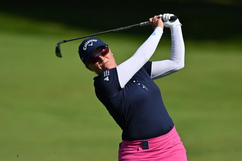 Belgium's Manon de Roey watches her approach shot from the 1st fairway on the opening day of the 2023 Women's British Open Golf Championship at Walton Heath Golf Club in Walton-on-the-Hill, south-west of London on August 10, 2023.  Glyn KIRK / AFP