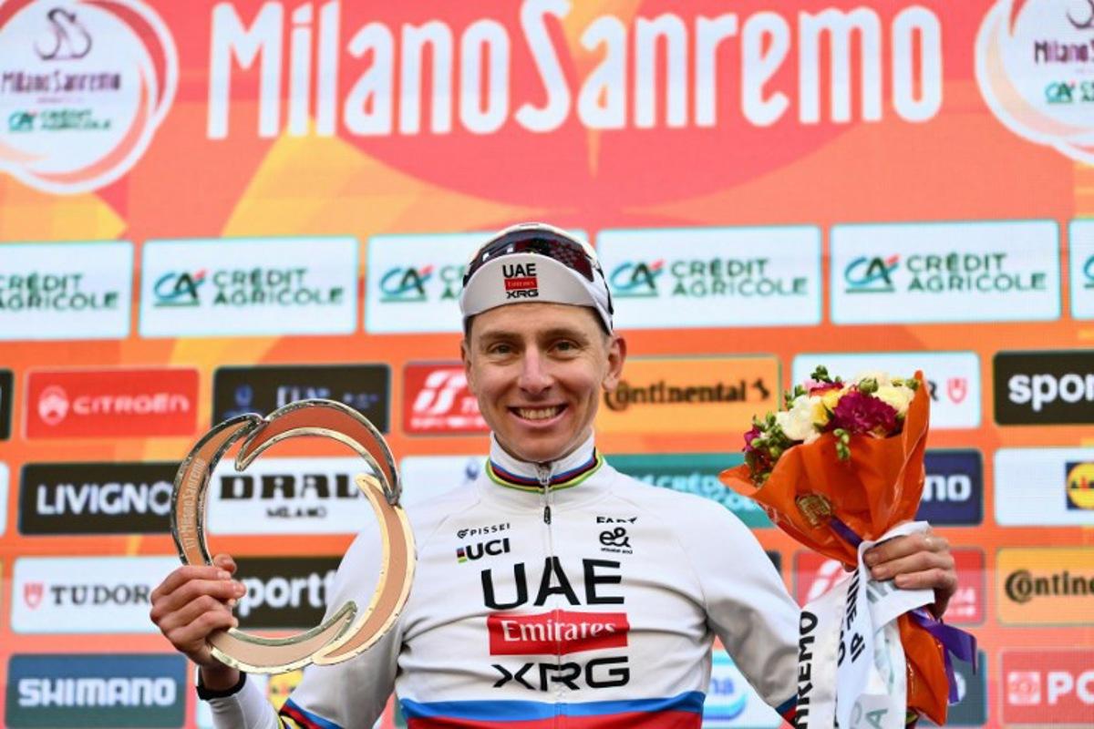 UAE Team Emirate's Slovenian rider Tadej Pogacar, winner, poses on the podium of the 117th Milan - Sanremo one-day classic cycling race, in Sanremo on March 21, 2026.  Marco BERTORELLO / AFP