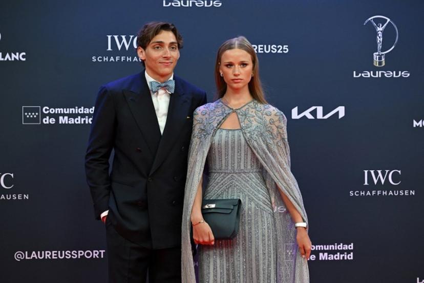 Swedish pole vaulter Armand Duplantis (L) and his partner pose on the Red Carpet ahead of the 26th Laureus World Sports Awards gala in Madrid on April 21, 2025.  JAVIER SORIANO / AFP
