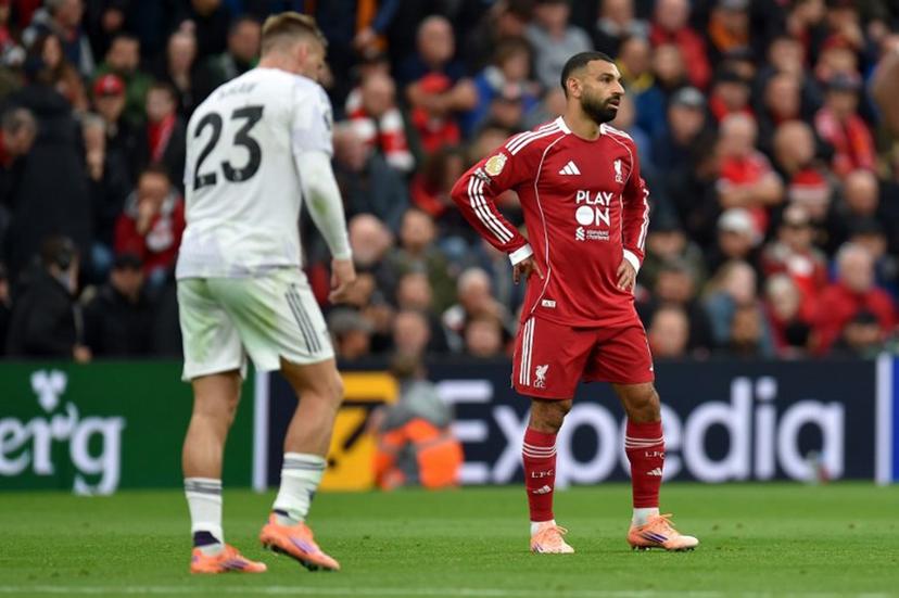Liverpool's Egyptian striker #11 Mohamed Salah reacts during the English Premier League football match between Liverpool and Manchester United at Anfield in Liverpool, north west England on October 19, 2025.  PETER POWELL / AFP