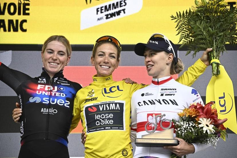 (From L) Second-placed FDJ-SUEZ team's Dutch rider Demi Vollering, overall winner Team Visma | Lease a Bike's French rider Pauline Ferrand-Prevot and third-placed Canyon//SRAM Racing team's Polish rider Katarzyna Niewiadoma celebrate on the podium after the 9th and last stage of the fourth edition of the Women's Tour de France cycling race at the end of the 9th and final stage (out of 9) 124.1 km from Praz-sur-Arly to Chatel, in Chatel, eastern France on August 3, 2025.  JULIEN DE ROSA / AFP