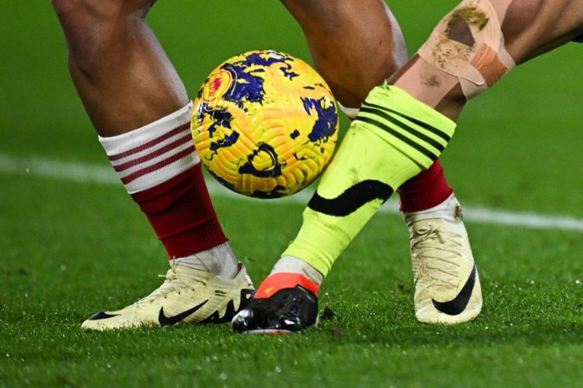 Nottingham Forest's Brazilian defender #40 Murillo (L) fights for the ball with Arsenal's Brazilian striker #09 Gabriel Jesus during the English Premier League football match between Nottingham Forest and Arsenal at The City Ground in Nottingham, central England, on January 30, 2024.  Paul ELLIS / AFP