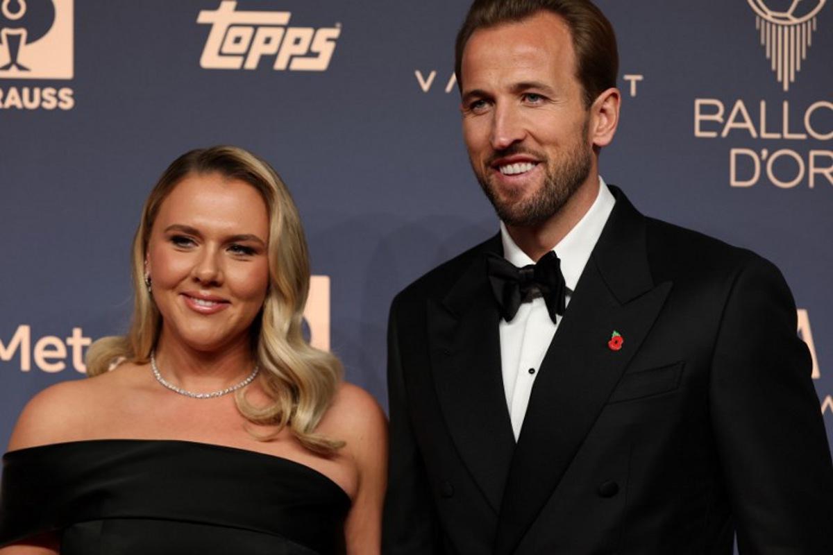 England and Bayern Munich forward Harry Kane and his wife Katie Goodland pose upon their arrival to attend the 2026 Ballon d'Or France Football award ceremony at the Palladium Theatre in London on October 26, 2026.  FRANCK FIFE / AFP