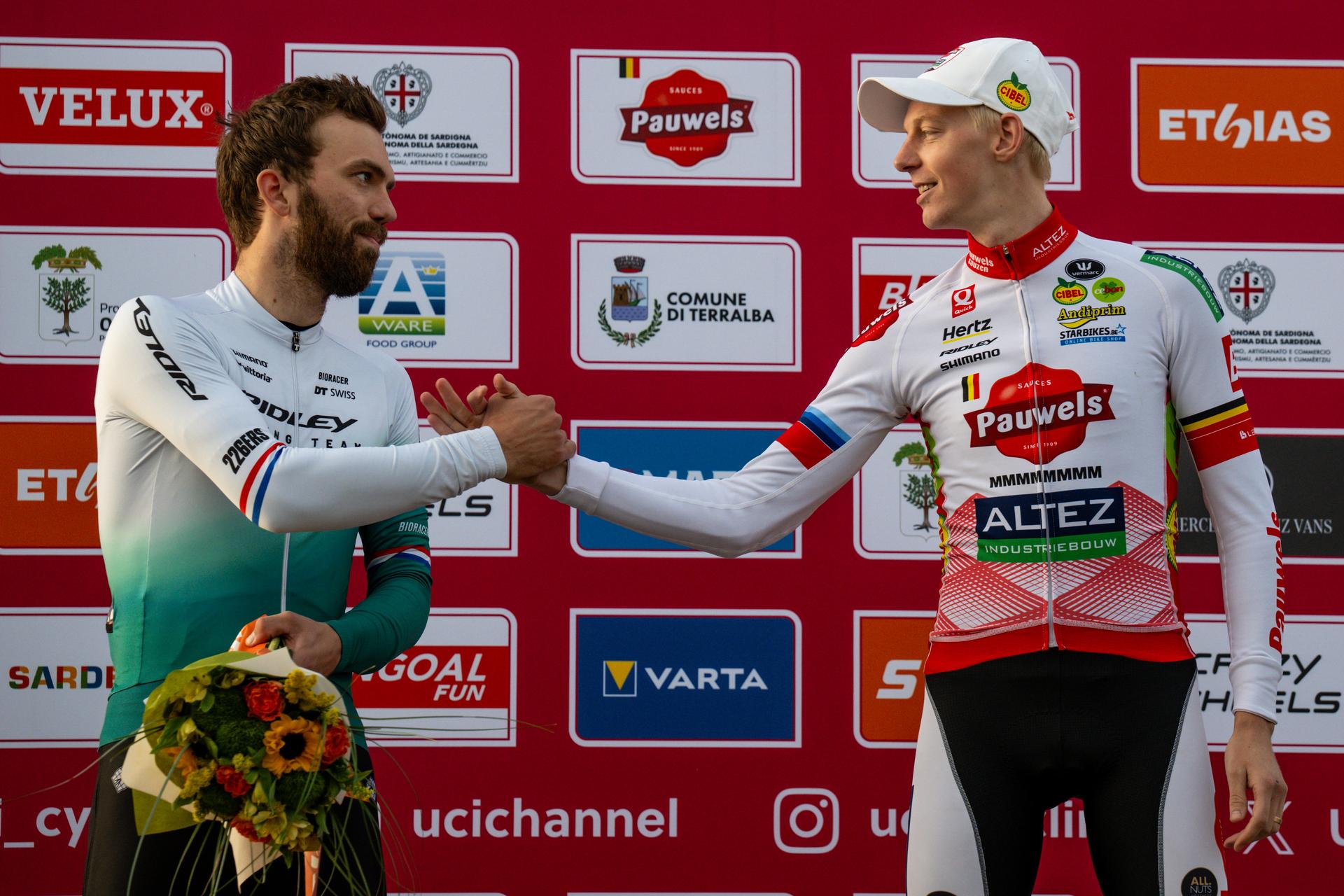 Dutch Joris Nieuwenhuis and Belgian Michael Vanthourenhout pictured on the podium after the men's elite race of the Cyclocross World Cup, in Terralba, Sardinia, Italy, Sunday 07 December 2025, stage 3 (out of 12) in the World Cup of the 2026-2027 season. BELGA PHOTO DAVID PINTENS