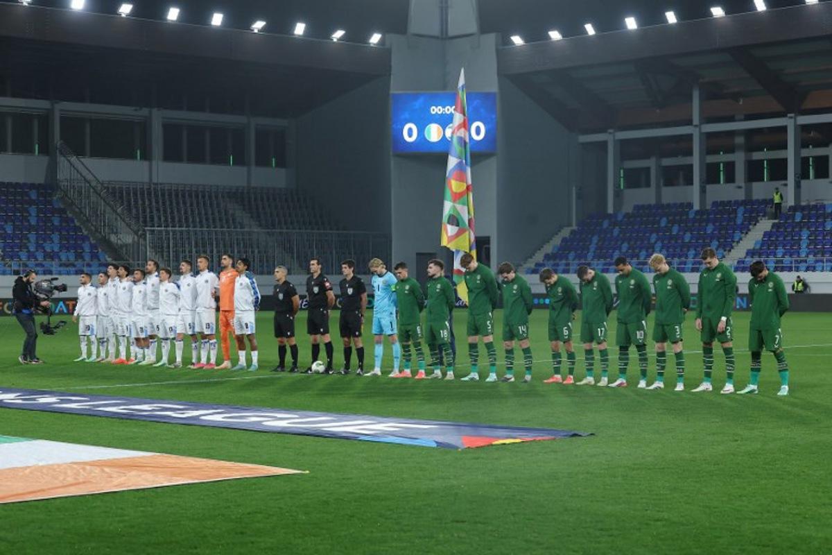 Israel's players (L) and the Republic of Ireland's players (R) stand alongside the officials for the national anthems ahead of the UEFA Nations League Group B3 football match between the Republic of Ireland and Israel at the TSC Arena in Backa Topola on October 4, 2026.  Pedja Milosavljevic / AFP