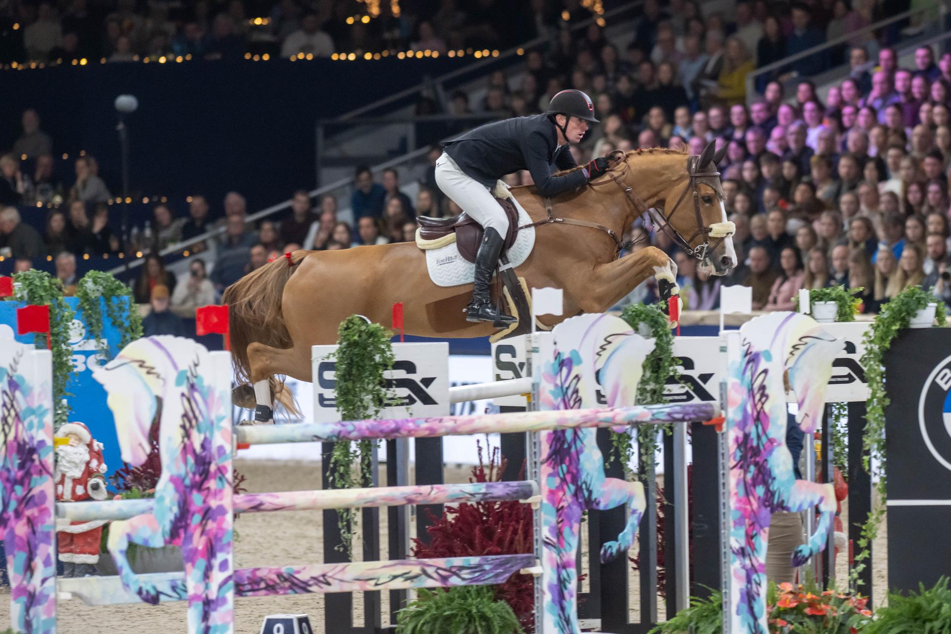 Rider Jos Verlooy and horse Renshaw van't Meulenhof are pictured during the FEI World Cup Jumping competition at the "Vlaanderens Kerstjumping" equestrian event in Mechelen on Tuesday 30 December 2025. BELGA PHOTO JONAS ROOSENS