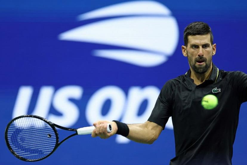 Serbia's Novak Djokovic plays a forehand return to Germany's Jan-Lennard Struff during their men's singles round of 16 tennis match on day eight of the US Open tennis tournament at the USTA Billie Jean King National Tennis Center in New York City, on August 31, 2025.  CHARLY TRIBALLEAU / AFP