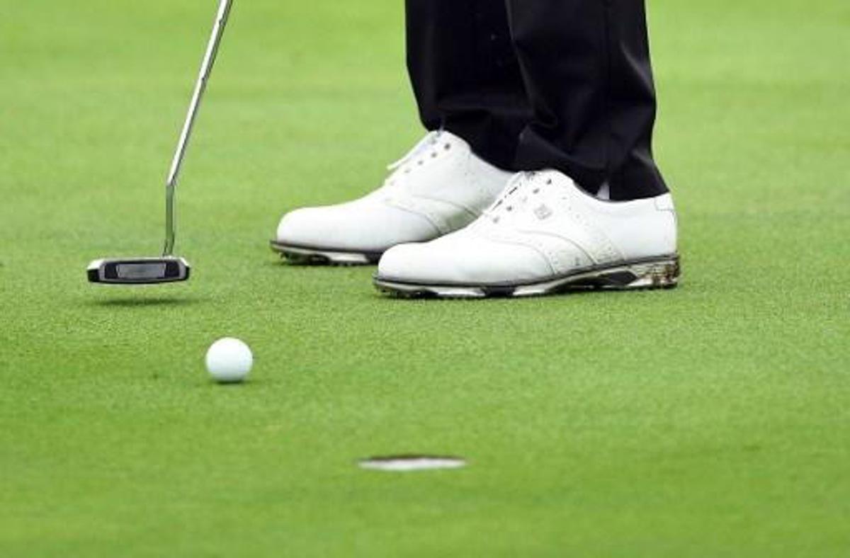 Daniel Berger of the US makes a putt at the World Golf Championships-HSBC Champions golf tournament in Shanghai on October 27, 2016. 
JOHANNES EISELE / AFP
