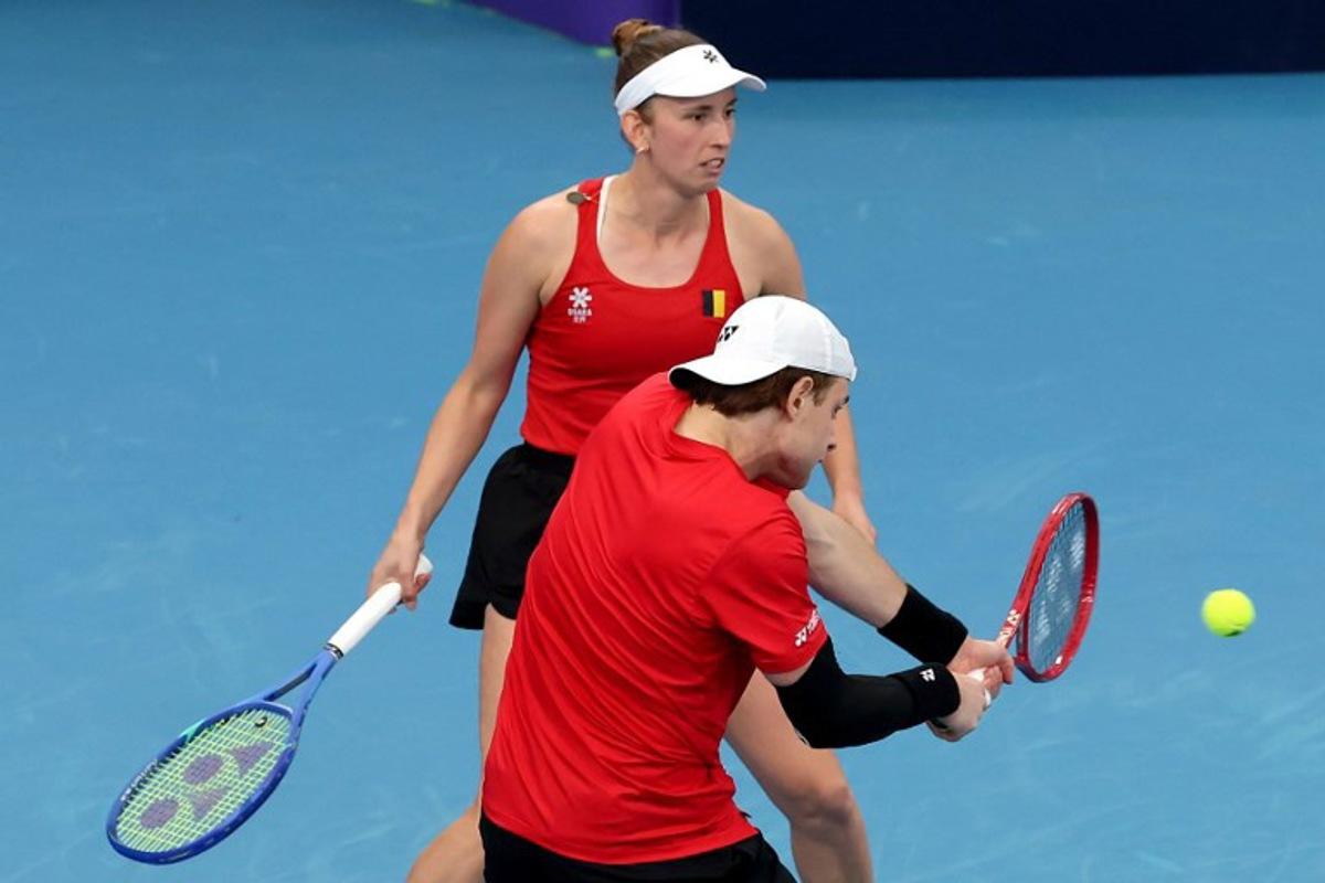 Belgium's Zizou Bergs (R) and Elise Mertens hit a return to China's Zhang Zhizhen and Zhu Lin during their mixed doubles match at the United Cup tennis tournament on Ken Rosewall Arena in Sydney on January 3, 2026.  DAVID GRAY / AFP