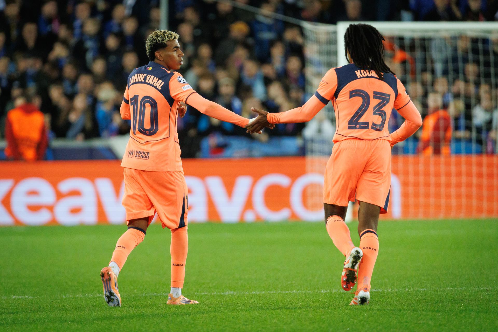 Barcelona's Lamine Yamal and Barcelona's Jules Kounde celebrate after scoring during a game between Belgian Club Brugge KV and Spanish FC Barcelona, on Wednesday 05 November 2025 in Brugge, on day four of the League phase of the UEFA Champions League tournament. BELGA PHOTO KURT DESPLENTER