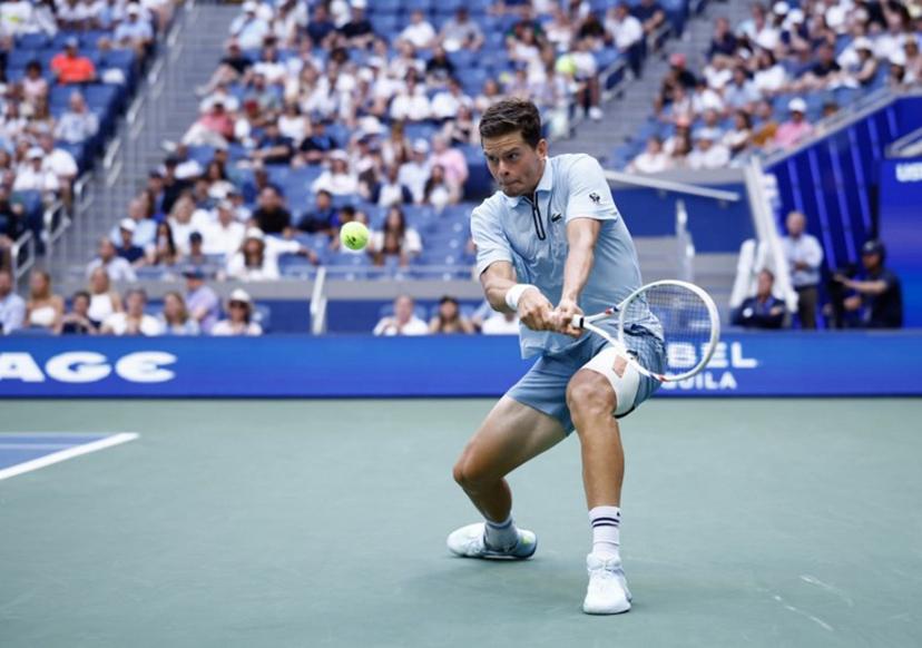 Belgium's Alexander Blockx hits a return to Argentina's Francisco Cerundolo during their men's singles round of 16 tennis match on day nine of the US Open tennis tournament at the USTA Billie Jean King National Tennis Center in New York on September 7, 2026.  kena betancur / AFP