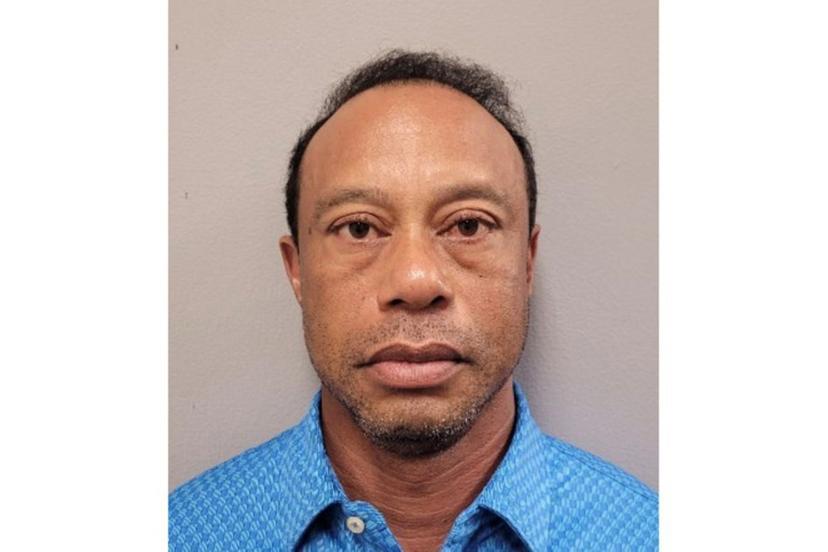 This handout mugshot released on March 27, 2026 provided by the Martin County Sheriff's Office shows the mugshot of US golfer Tiger Woods, 50, who was arrested in Jupiter Island, Florida on March 27, 2026. The golf icon was arrested and charged with driving under the influence after a rollover crash near his Florida home, authorities said. HANDOUT / Florida Department of Corrections / AFP