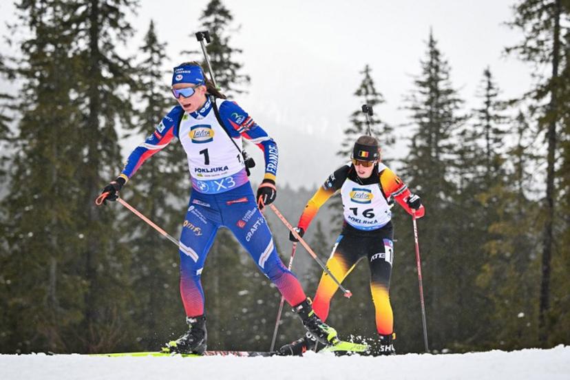 France's Justine Braisaz-Bouchet (L) and Belgium's Eve Bouvard compete during the Women 12.5 km Short Individual competition of the IBU Biathlon World Cup in Pokljuka, Slovenia on March 13, 2025.  Jure Makovec / AFP