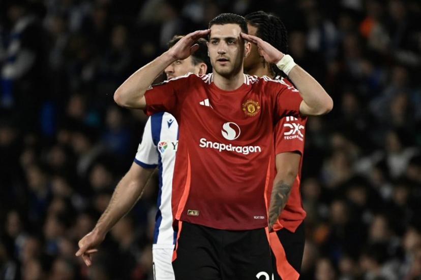 Manchester United's Portuguese defender #20 Diogo Dalot reacts after Real Sociedad was awarded a penalty during the UEFA Europa League Round of 16 first let football match between Real Sociedad and Manchester United at Anoeta Stadium in San Sebastian on March 6, 2025.  ANDER GILLENEA / AFP