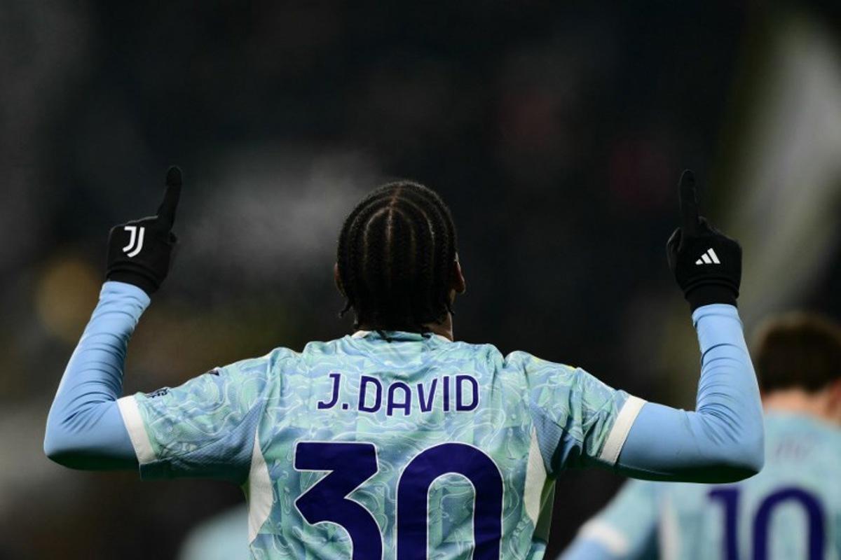 Juventus' Canadian forward #30 Jonathan David celebrates scoring his team's third goal during the Italian Serie A football match between Sassuolo and Juventus at the Mapei - Città del Tricolore stadium in Reggio Emilia, on January 6, 2026.  Marco BERTORELLO / AFP