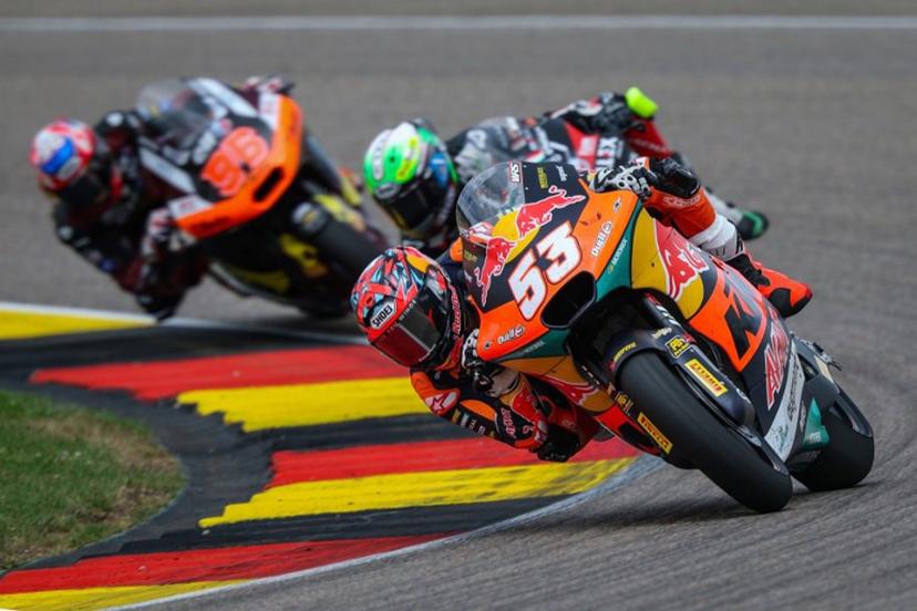 Red Bull KTM Ajo Team's Turkish Moto2 rider Deniz Oncu (R) leads next to Fantic Racing Team's Belgiums Moto2 rider Barry Baltus (C) and Elf Marc VDS Racing Team's Great Britain Moto2 rider Jake Dixon (L) during the German Moto2 Grand Prix at the Sachsenring racing circuit, in Hohenstein-Ernstthal near Chemnitz, eastern Germany on July 13, 2025.  Ronny Hartmann / AFP